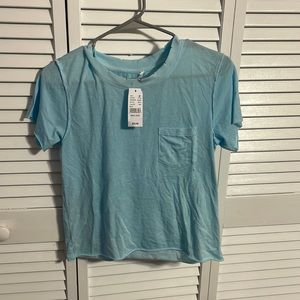 PacSun Women Tee shirt, Size medium and color is a baby blue.